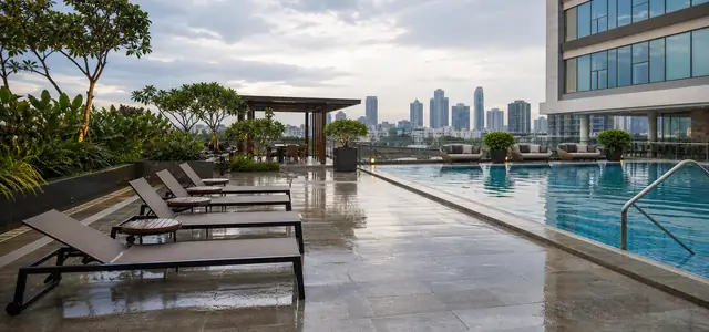 Hotel rooftop pool deck after rainfall